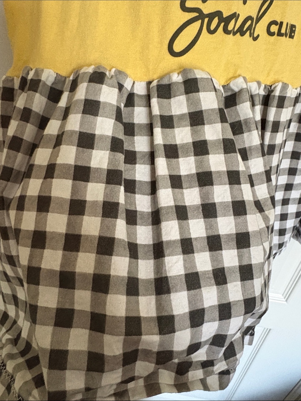 Peanuts Yellow & Black Snoopy Graphic Babydoll Tee Tunic with Gingham Hem - Picture 4 of 7